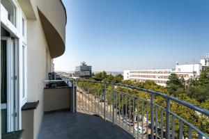 a balcony with a view of a city at My Hotel Apollon in Prague