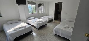 Uma cama ou camas num quarto em Hotel Bayadera Real