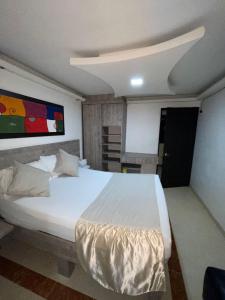 Voodi või voodid majutusasutuse Hotel Plaza Norte Cali toas