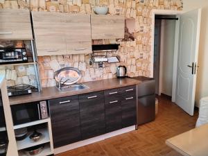 a kitchen with a sink and a counter top at Peaceful oasis in Athens