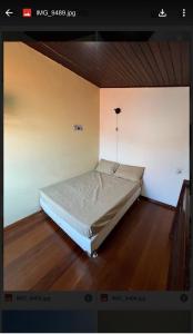 a bedroom with a bed in the corner of a room at Praia das Dunas Residence Club in Cabo Frio +22 photos