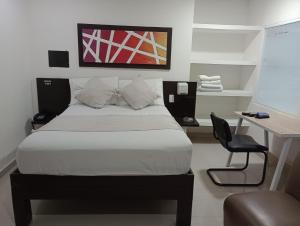 Voodi või voodid majutusasutuse Hotel Plaza Norte Cali toas