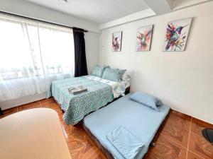 Voodi või voodid majutusasutuse Pereira Central Aparta-estudio toas