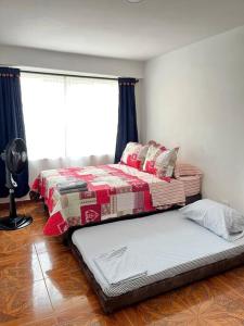 En eller flere senge i et værelse på Central Aparta-estudio Pereira