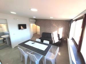 a living room with a table and a couch at Casa Borgo Antico Cavallaro in Gaggi