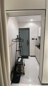 a room with a ladder and a room with a kitchen at Modern studio Self entry in Riyadh +5 photos