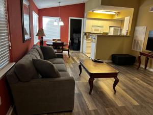 a living room with a couch and a coffee table at Beautiful two master bedroom condo in Fort Myers, Venetian Palms condominium in Fort Myers