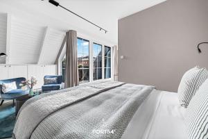 a bedroom with a bed and a desk and a window at Ferienwohnung Erholen St Peter Ording in Böhl +23 photos