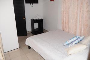 Hotel Guaquira Real客房内的一张或多张床位