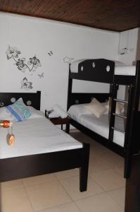 Hotel Guaquira Real客房内的一张或多张床位