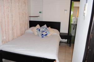 Hotel Guaquira Real客房内的一张或多张床位