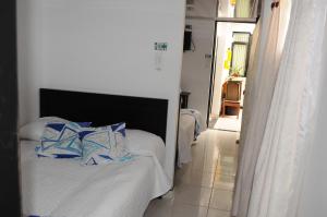 Hotel Guaquira Real客房内的一张或多张床位