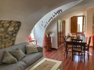 a living room with a couch and a table at B&B Chiostro San Marco in Tarquinia