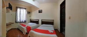 Postel nebo postele na pokoji v ubytování Xpress Inn