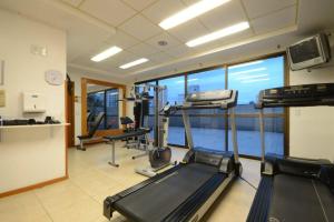 a gym with two treadmills and a treadmill at JK Studio centro, você merece o melhor! in Novo Hamburgo