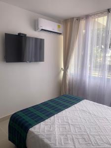 Ένα ή περισσότερα κρεβάτια σε δωμάτιο στο Hermoso apartamento en Ricaurte Cundinamarca
