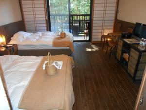 Shimantonoyado客房内的一张或多张床位