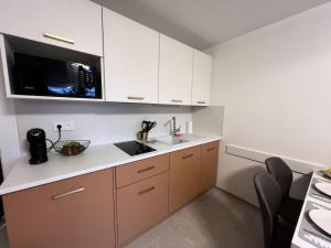 Kuchyň nebo kuchyňský kout v ubytování Résidence Bez - Studio · Cœur de station · Parking collectif & casier à skis MAE-9064 + 3 fotografie