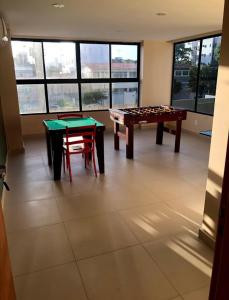 a room with a ping pong table and a table at Recife Olinda perto de tudo in Recife
