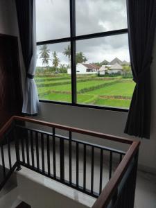 Balkón nebo terasa v ubytování Sujiwa Ubud Hotel & Villa