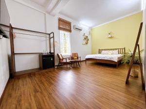 Ein Bett oder Betten in einem Zimmer der Unterkunft Mô Tê Homestay 2 gần Chợ Đông Ba, Cung Đình Hoàng Thành Huế