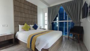 Postel nebo postele na pokoji v ubytování Solesor Kampong Beach Resort + 27 fotografií