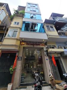 a building with a store in front of it at Hanoi Old Town in Hanoi