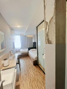 Postel nebo postele na pokoji v ubytování Hako Hotel