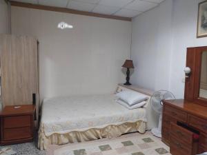 Ein Bett oder Betten in einem Zimmer der Unterkunft 西濱休息站旁