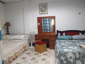 Ein Bett oder Betten in einem Zimmer der Unterkunft 西濱休息站旁