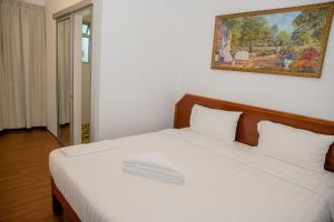 Postel nebo postele na pokoji v ubytování Ong Hotel + 10 fotografií