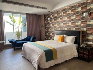 Postel nebo postele na pokoji v ubytování 浪琴Motel文創旅館