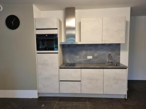 Η κουζίνα ή μικρή κουζίνα στο Zuiderlijk Genieten +4 φωτογραφίες