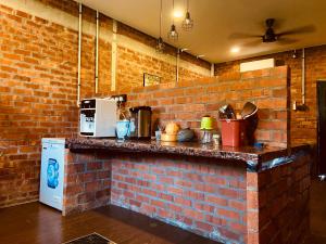 Kuchyň nebo kuchyňský kout v ubytování Homestay Damai D'Sawah