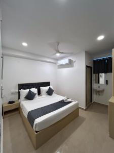 a bedroom with a large bed in a room at Wildwings hotel in Hyderabad