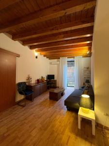 a bedroom with a bed and a desk in a room at Fikus APT relax Castello Ursino in Catania