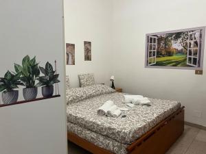a bedroom with a bed with speakers on it at La tana moderna in Piacenza