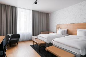 Postel nebo postele na pokoji v ubytování Solo Sokos Hotel Helsinki