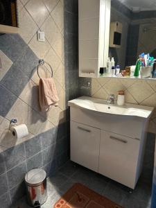 a bathroom with a sink and a mirror at Amfipolis Root House in Próti +35 photos