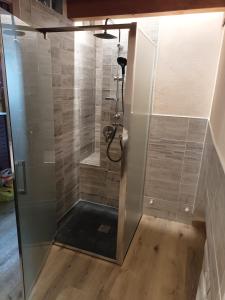 a bathroom with a shower with a glass door at Trilocale con vista La Grandze Cir164 in La Salle