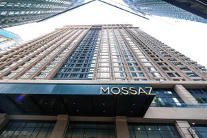 a large building with a msg sign in front of it at Mossaz Suites by MyKey in Petaling Jaya