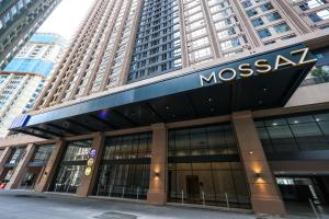 a msg building in a city with tall buildings at Mossaz Suites by MyKey in Petaling Jaya
