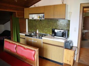 A kitchen or kitchenette at Apartment with balcony - formerly TUI Ferienhaus