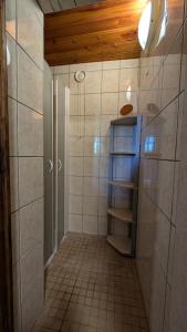 a bathroom with a shower and a tiled hallway at Rustique & authentique maison au vert in Rai-sur-Rîle +19 photos