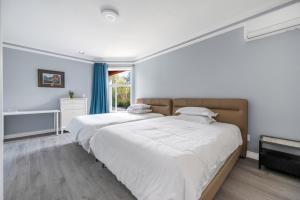 Postel nebo postele na pokoji v ubytování Amy Guesthouse