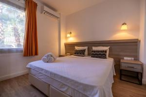 Postel nebo postele na pokoji v ubytování Ladonia Hotels Mio Bianco