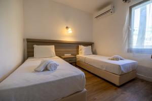 Postel nebo postele na pokoji v ubytování Ladonia Hotels Mio Bianco