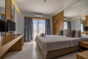 TV a/nebo společenská místnost v ubytování Ladonia Hotels Mio Bianco