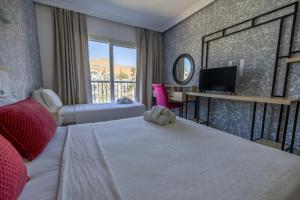 Postel nebo postele na pokoji v ubytování Ladonia Hotels Mio Bianco + 37 fotografií