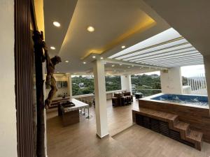 a living room with a jacuzzi tub in a building at Casa Del Agua Tepeji in Presa Requena